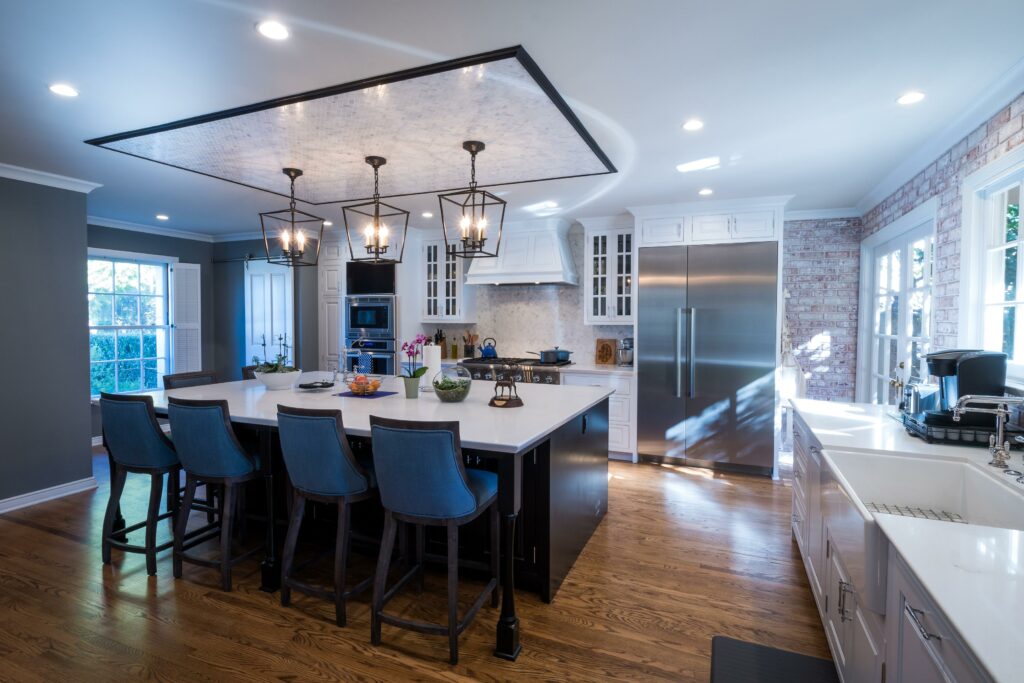 Modern kitchen with island and stainless steel appliances.