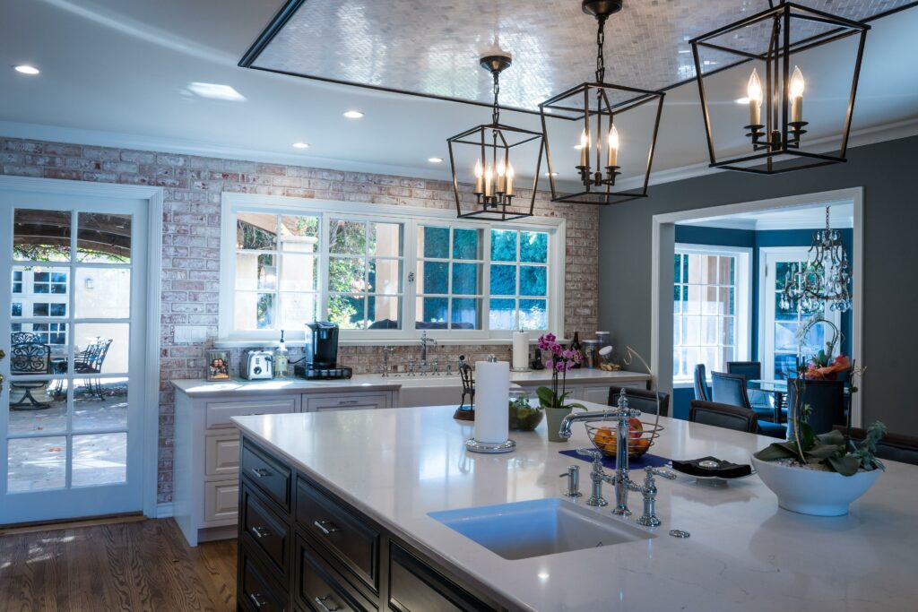 Modern kitchen interior with elegant lighting fixtures.