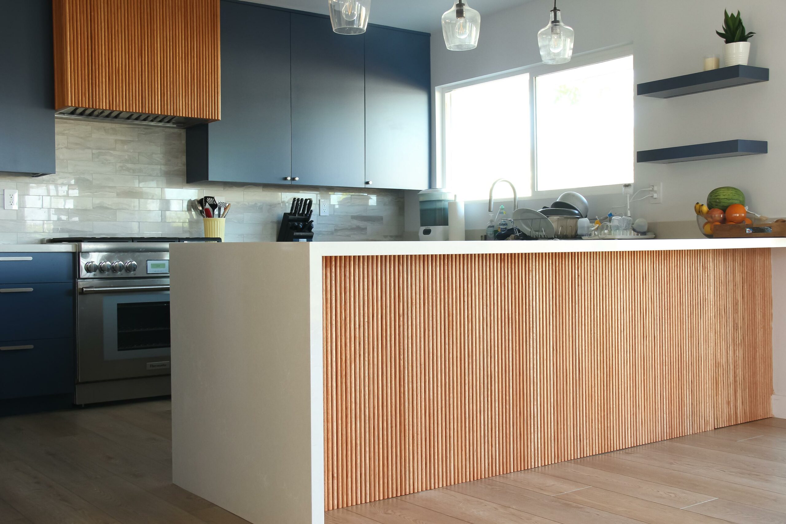 Modern kitchen interior with wooden design elements.