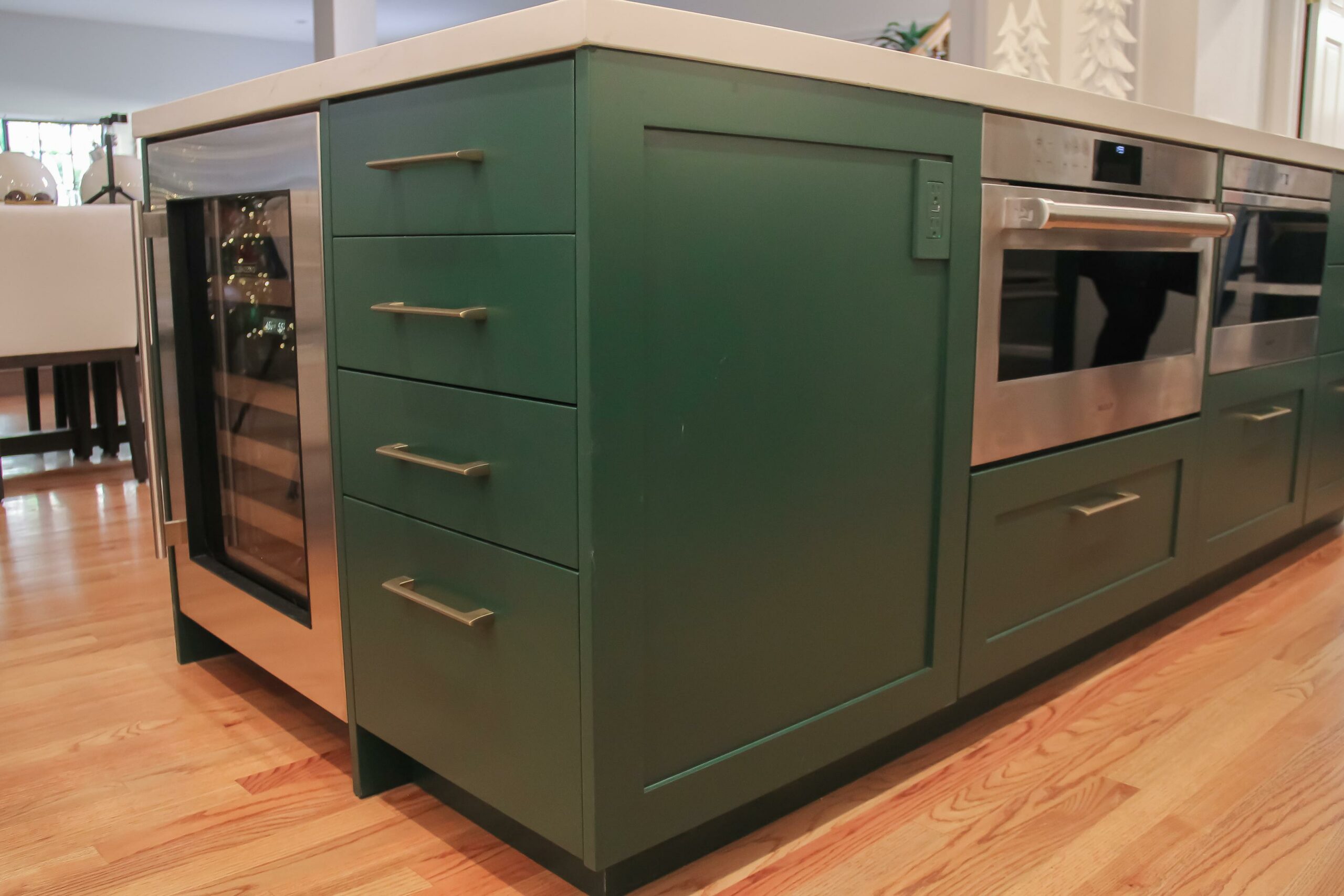 Modern green kitchen cabinets with stainless steel oven