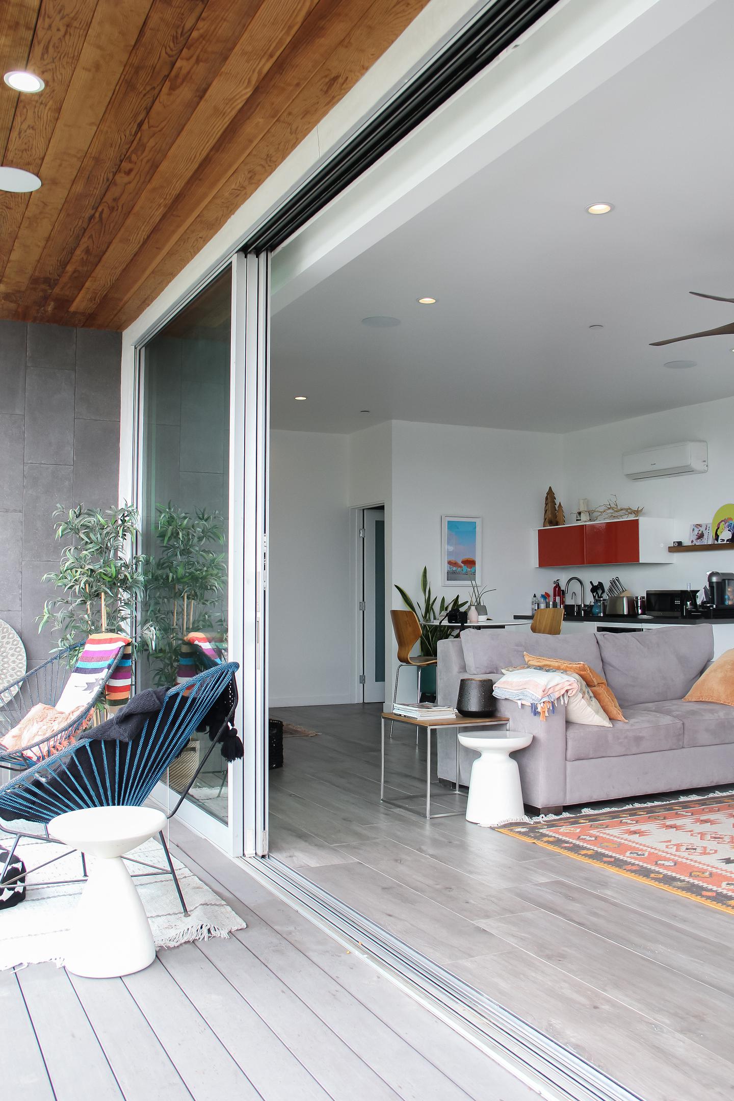 Modern interior, sliding glass door, cozy living space.