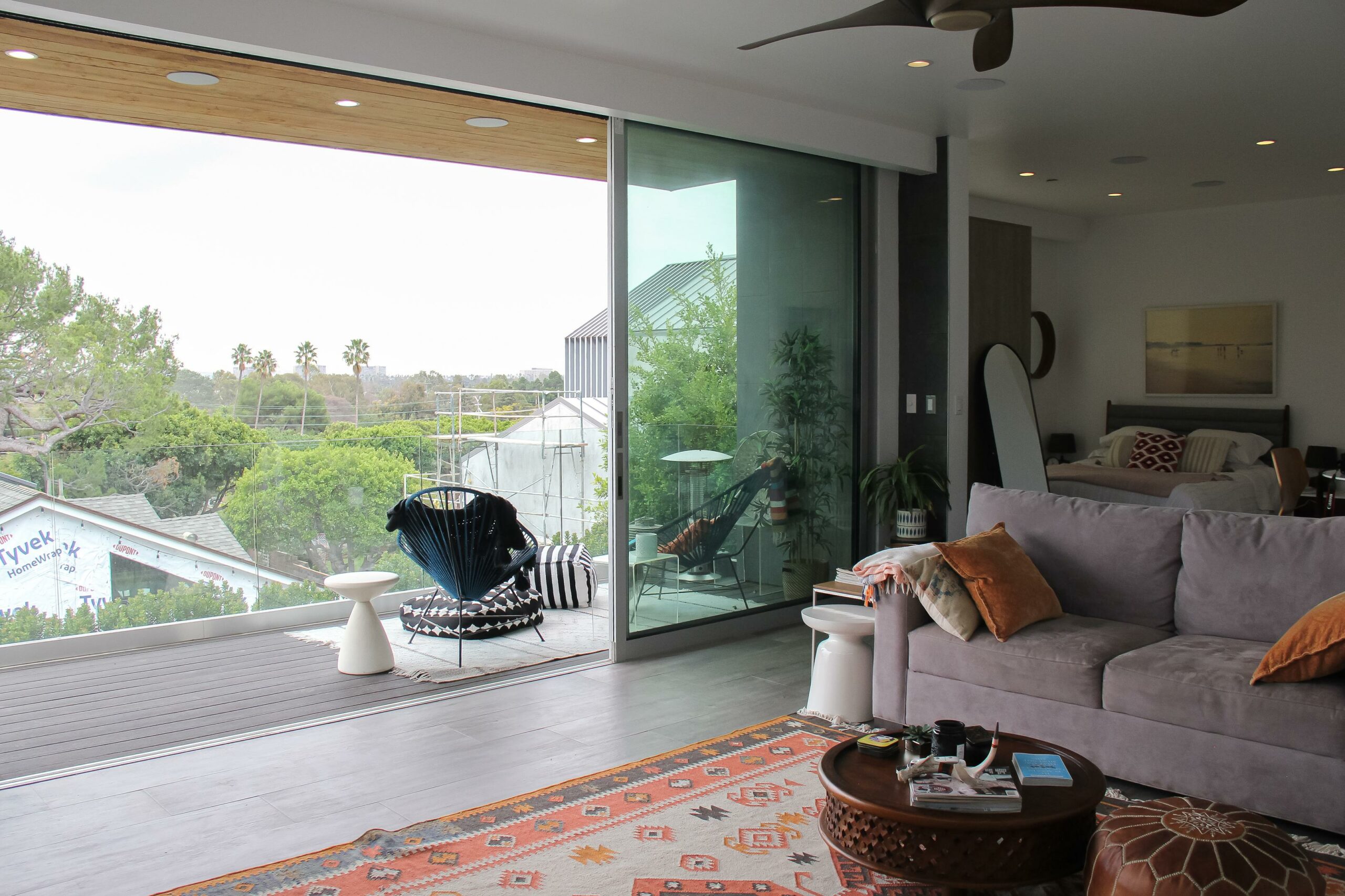 Modern living room with large window and outdoor view.