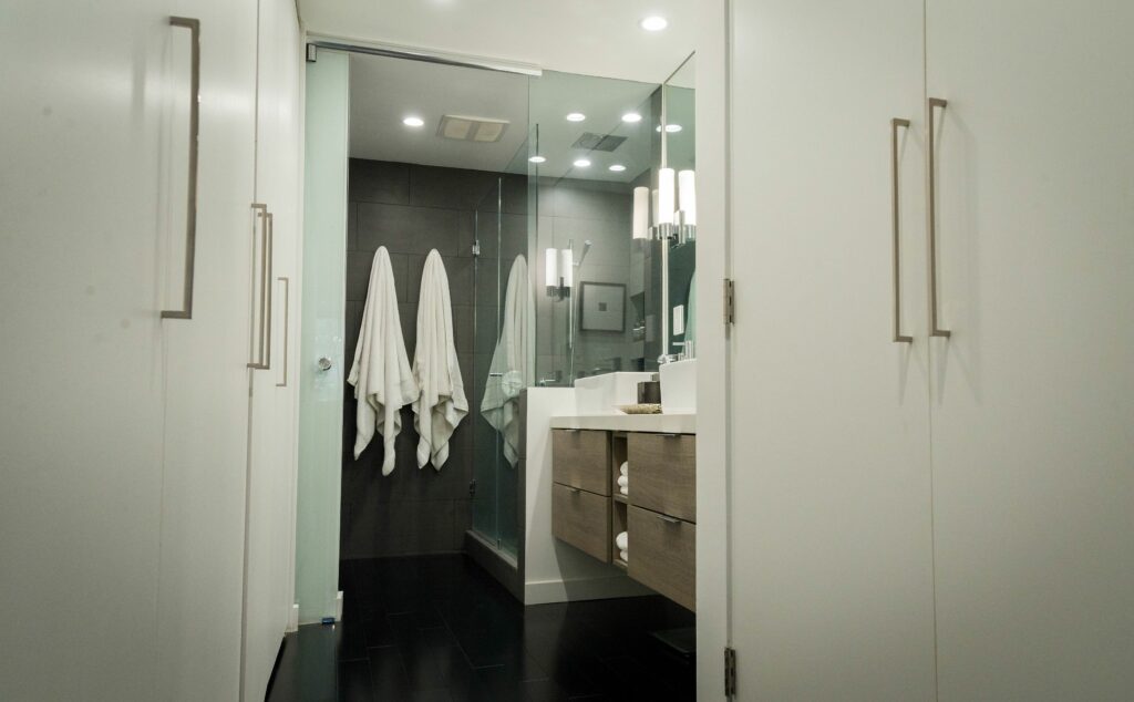 Modern bathroom interior with walk-in shower.