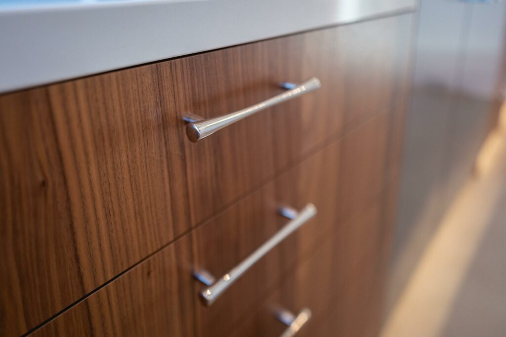 Close-up of modern wooden cabinet handles