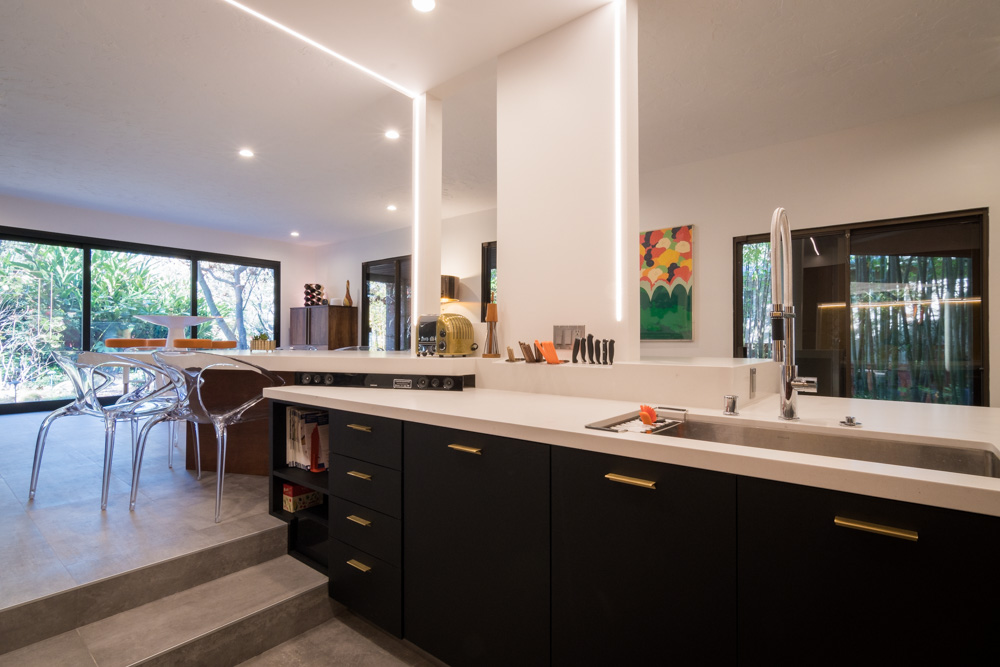 Modern kitchen interior, LED lighting, open plan design.