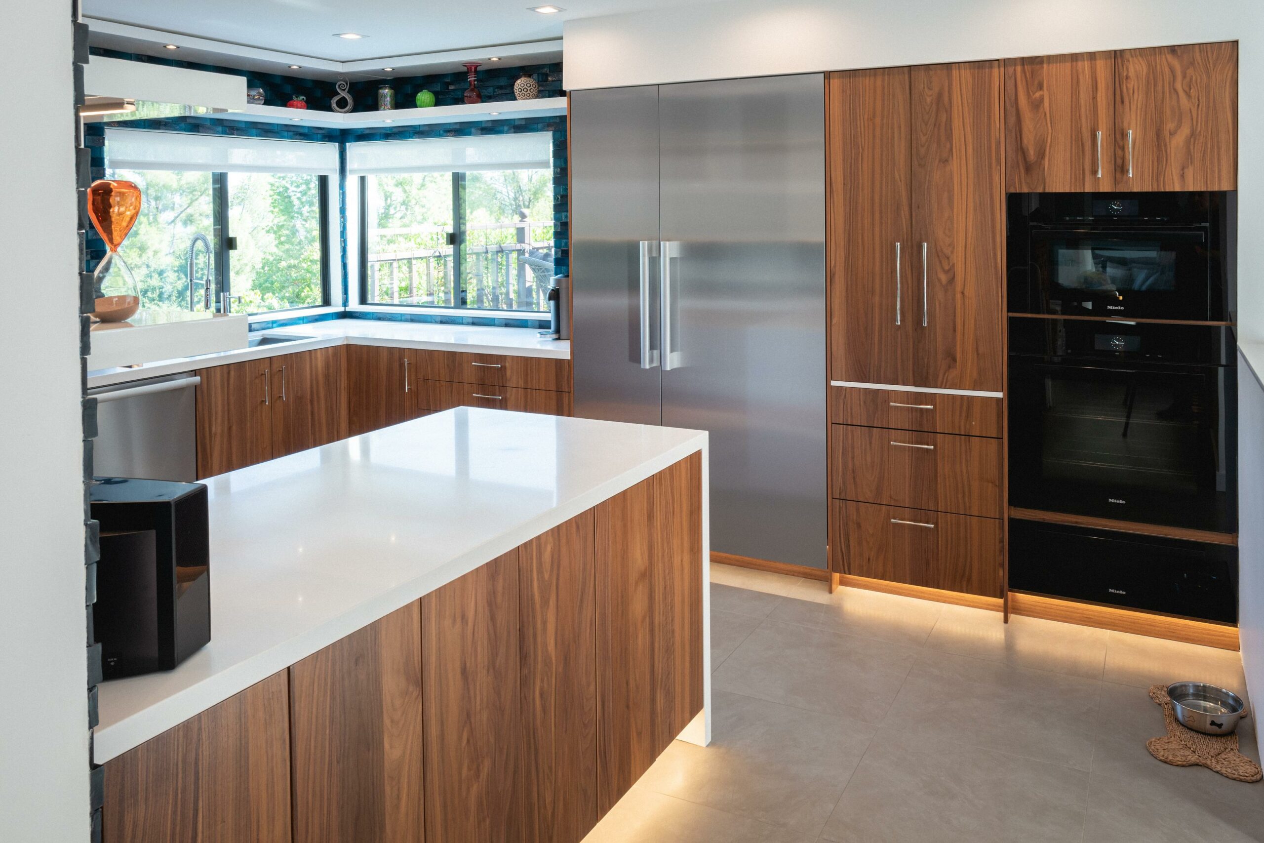 Modern kitchen with wooden cabinets and island.